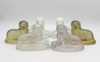 Six John Derbyshire moulded glass dogs, including, two white, two uranium and two clear examples