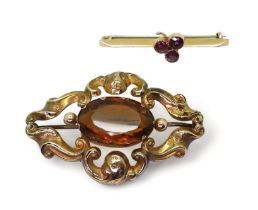 A 9ct gold garnet shamrock bar brooch, together with a yellow metal Victorian brooch set with a