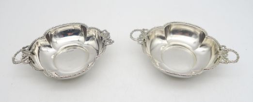 A pair of late-Victorian silver twin-handled dishes, by James & William Deakin, Sheffield 1896, of