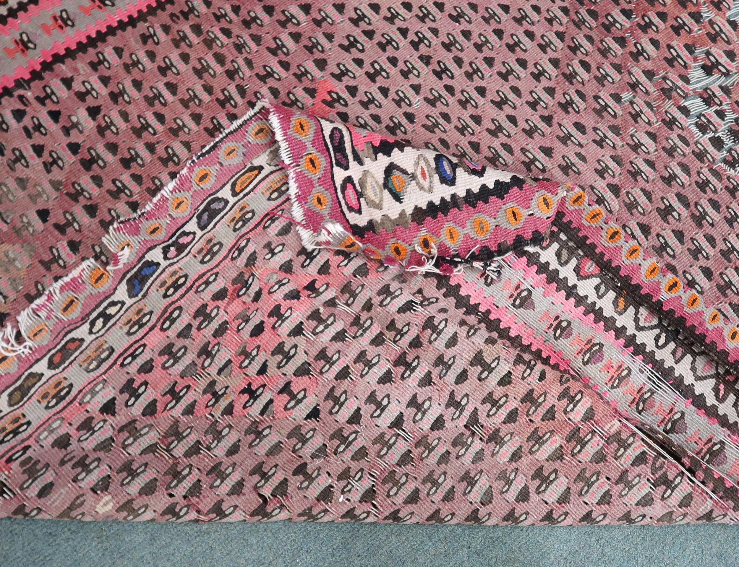 A pink ground Malayer runner with multicoloured borders, 260cm long x 134cm wide Condition Report: - Image 4 of 4