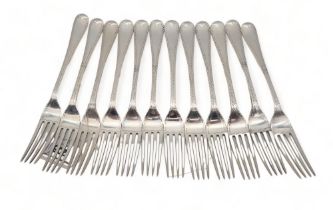A set of late Victorian silver forks, by White, Henderson & Co, Sheffield 1877, in the Hanoverian