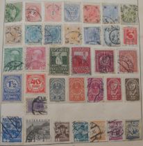 Postage Stamps of the World in a Strand Album with early Great Britain, Hong Kong, France, United