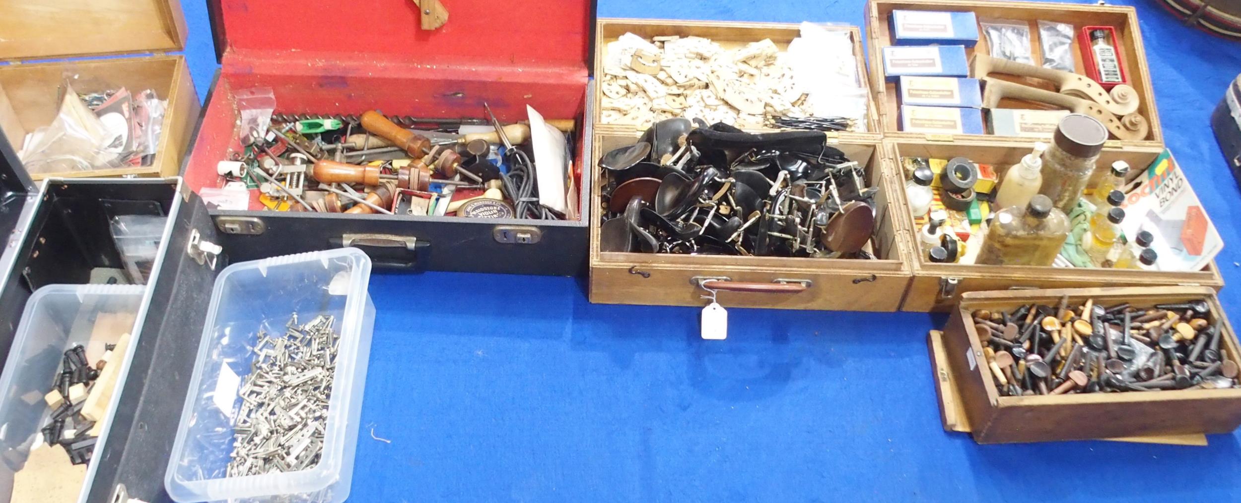 A lot comprising the contents of a luthier's workshop to include various violin parts, violin makers