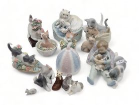 A collection of Lladro cats and kittens and a Boy and Puppy group Condition Report:Available upon