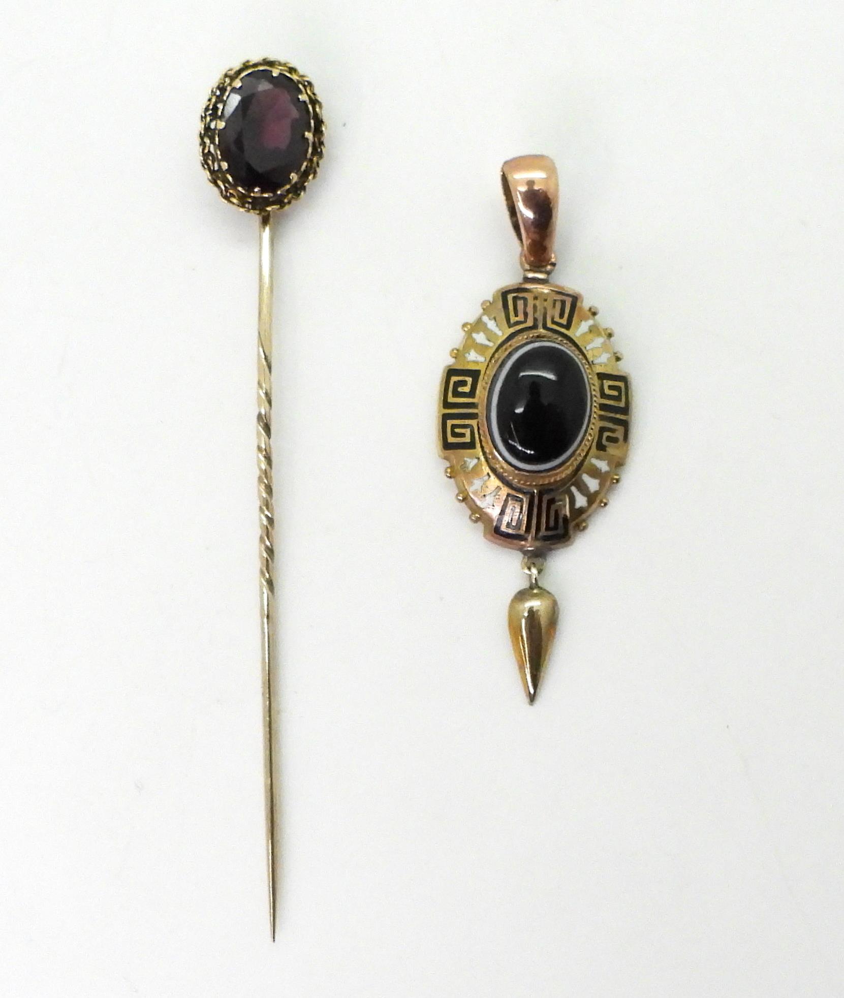 A Victorian yellow metal pendant set with a Bull's eye agate, with black and white Greek key and bud - Image 2 of 4