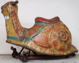 A circa 1950s Mobo child's ride on snail, 43cm high Condition Report:Available upon request