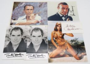 AUTOGRAPHS A small collection of James Bond signed photographs, comprising Sean Connery, Timothy