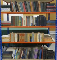 Four shelves of assorted books, to include academic and theological titles, alongside paperback