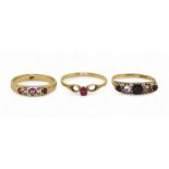 A 9ct gold ruby and diamond accent ring, size P, a 9ct garnet and clear gem ring size P1/2, and a