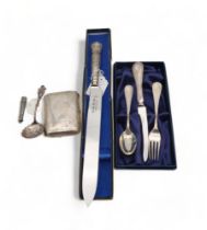 A collection of silver cutlery including a christening set, by Carrs of Sheffield, a cheroot holder,