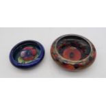 A William Moorcroft pomegranate pattern bowl, 13cm diameter, together with a Pansy pattern bowl