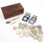 A burr walnut-veneered cigarette box, silver and mother of pearl-handled spoon and miniature fork