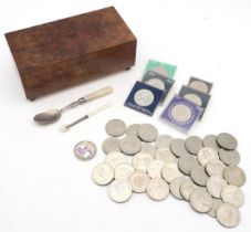 A burr walnut-veneered cigarette box, silver and mother of pearl-handled spoon and miniature fork