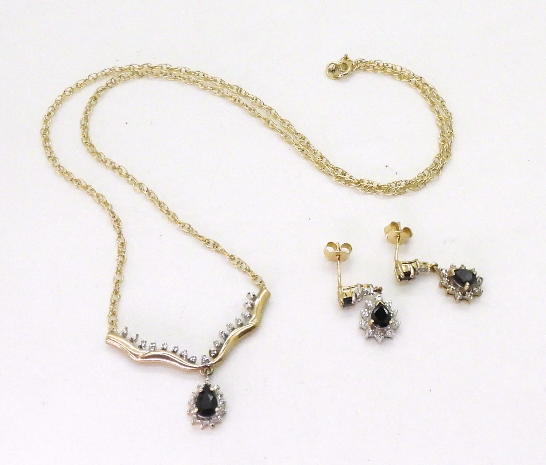 A 9ct gold sapphire and diamond accent pendant necklace, with matching earrings weight together 6gms - Image 2 of 2
