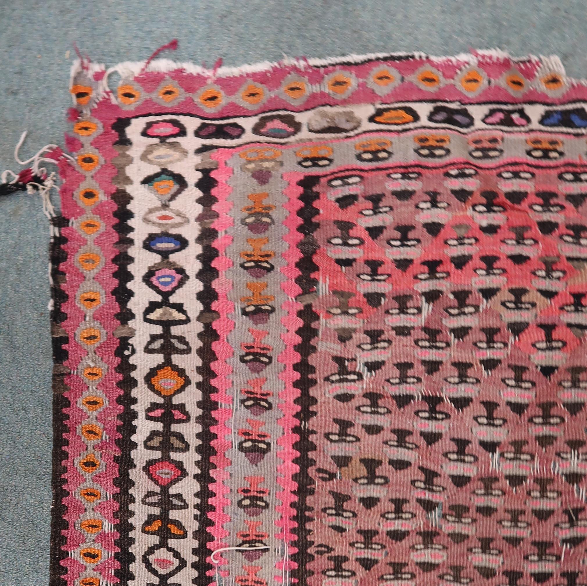 A pink ground Malayer runner with multicoloured borders, 260cm long x 134cm wide Condition Report: - Image 2 of 4