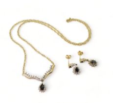 A 9ct gold sapphire and diamond accent pendant necklace, with matching earrings weight together 6gms