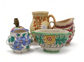 A collection of Charlotte Rhead for Crown Ducal pottery including a handled vase, a jug, a small