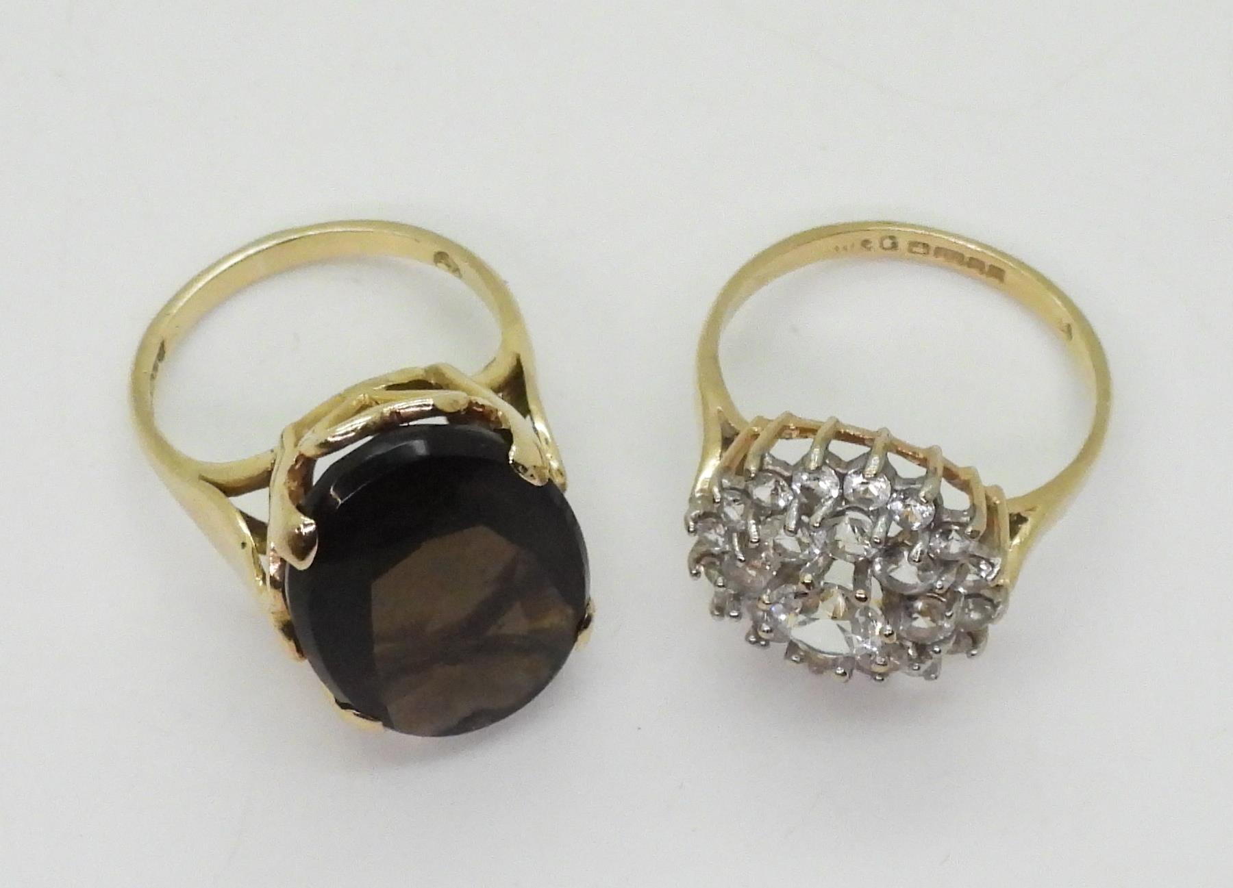 A 9ct gold smoky quartz ring, hallmarked London 1963, size K, and a clear gem set cluster, size O, - Image 3 of 3