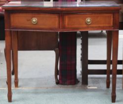 A 20th century mahogany serpentine front two drawer hall table on square tapering supports, 78cm