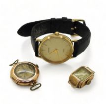 A 9ct gold Accurist watch together with two 9ct gold cased vintage watch heads, weight all