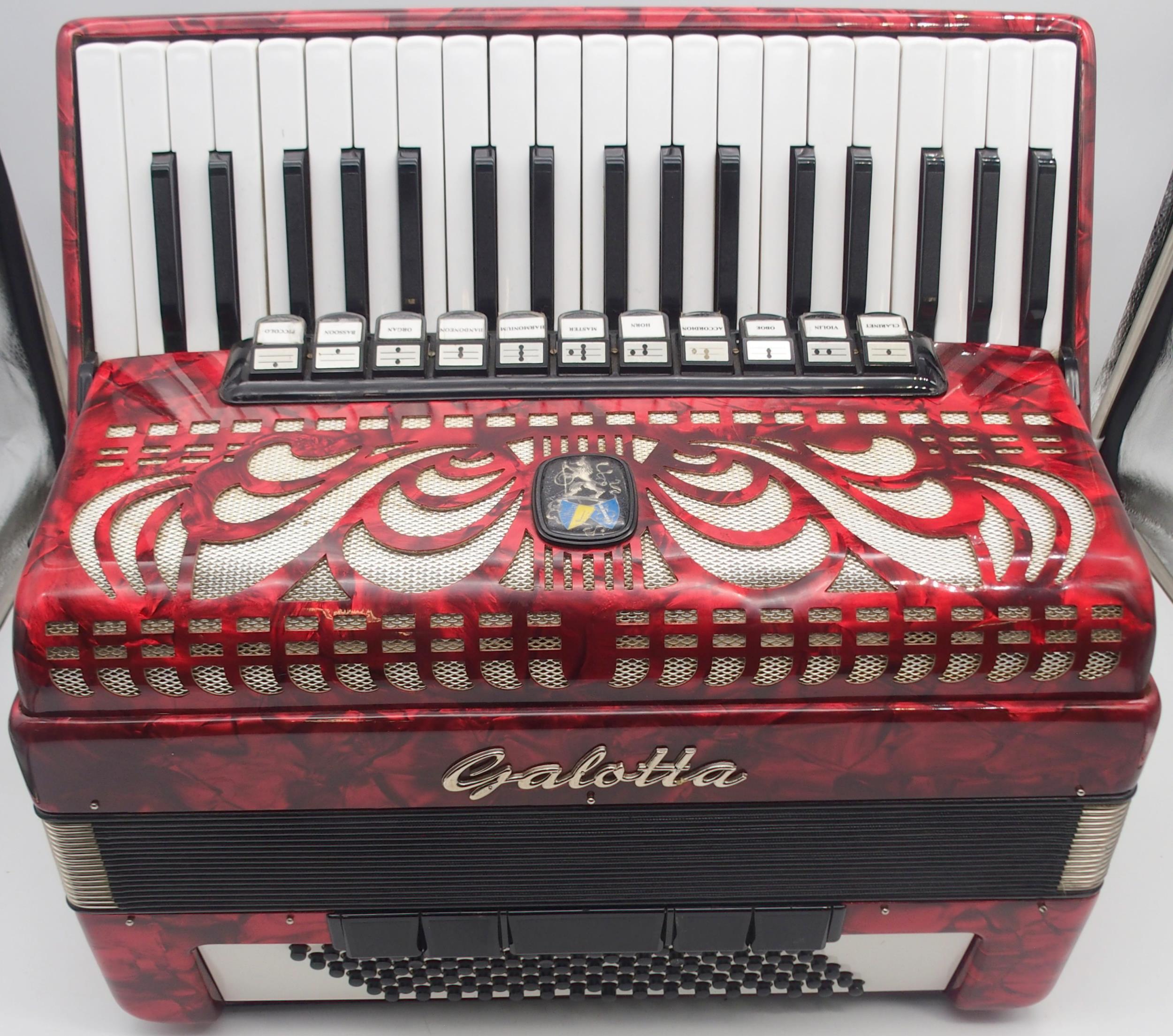 A Galotta IV voice 96 bass 37 key piano accordion in red with a fitted case Condition Report: