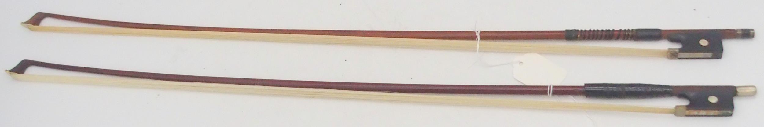 A violin bow 61 grams and another 61 grams Condition Report:Available upon request