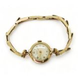 A 9ct gold ladies Rotary watch and strap hallmarked London 1960, weight without mechanism 9gms