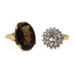 A 9ct gold smoky quartz ring, hallmarked London 1963, size K, and a clear gem set cluster, size O,