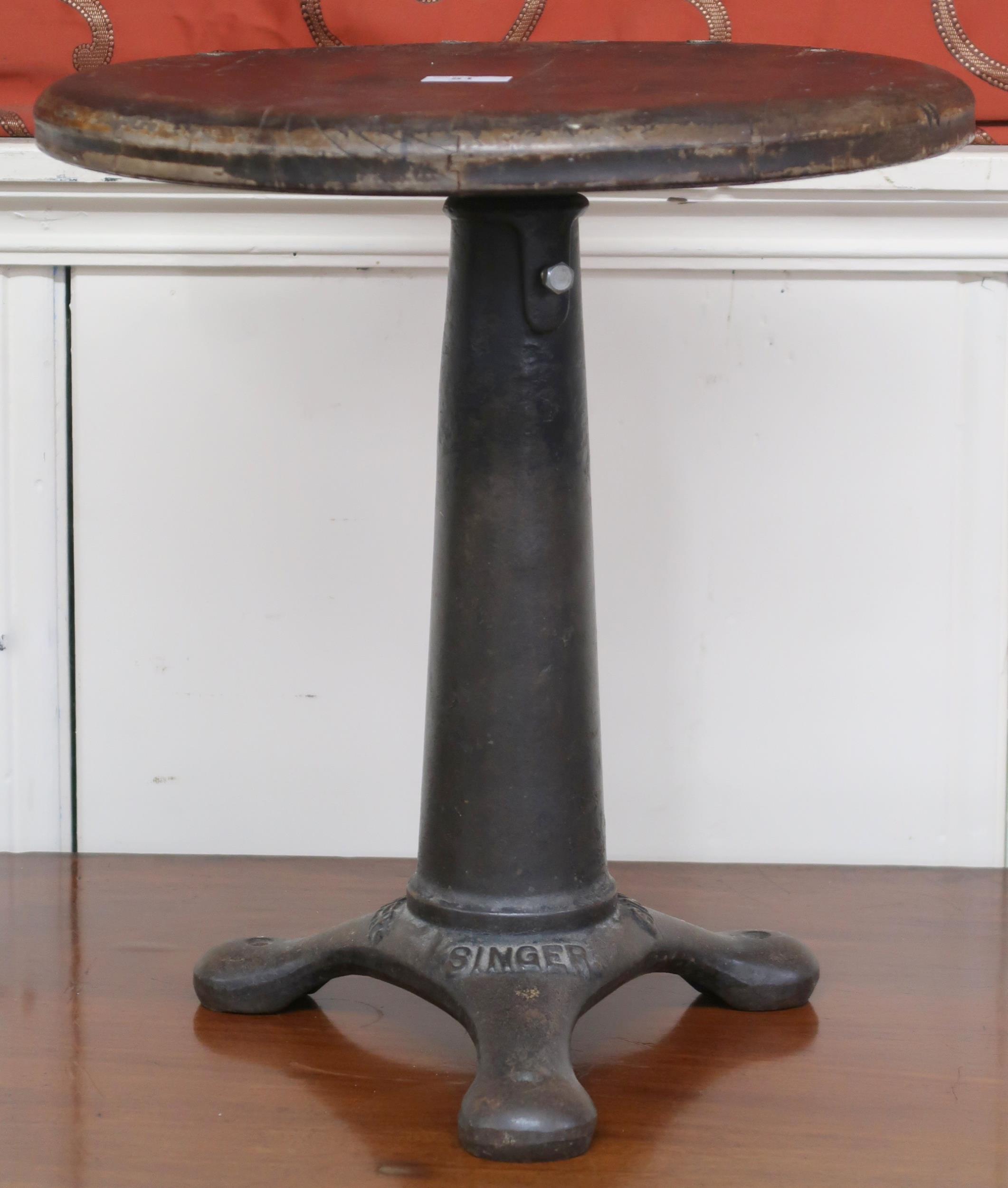 An early to mid 20th century Singer machinists stool converted to a sculpture stand, 49cm high x
