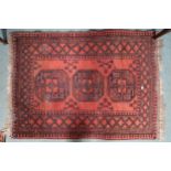 A lot comprising two assorted Bokhara style rugs, first, 137cm long x 104cm wide and second, 147cm