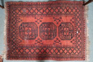 A lot comprising two assorted Bokhara style rugs, first, 137cm long x 104cm wide and second, 147cm