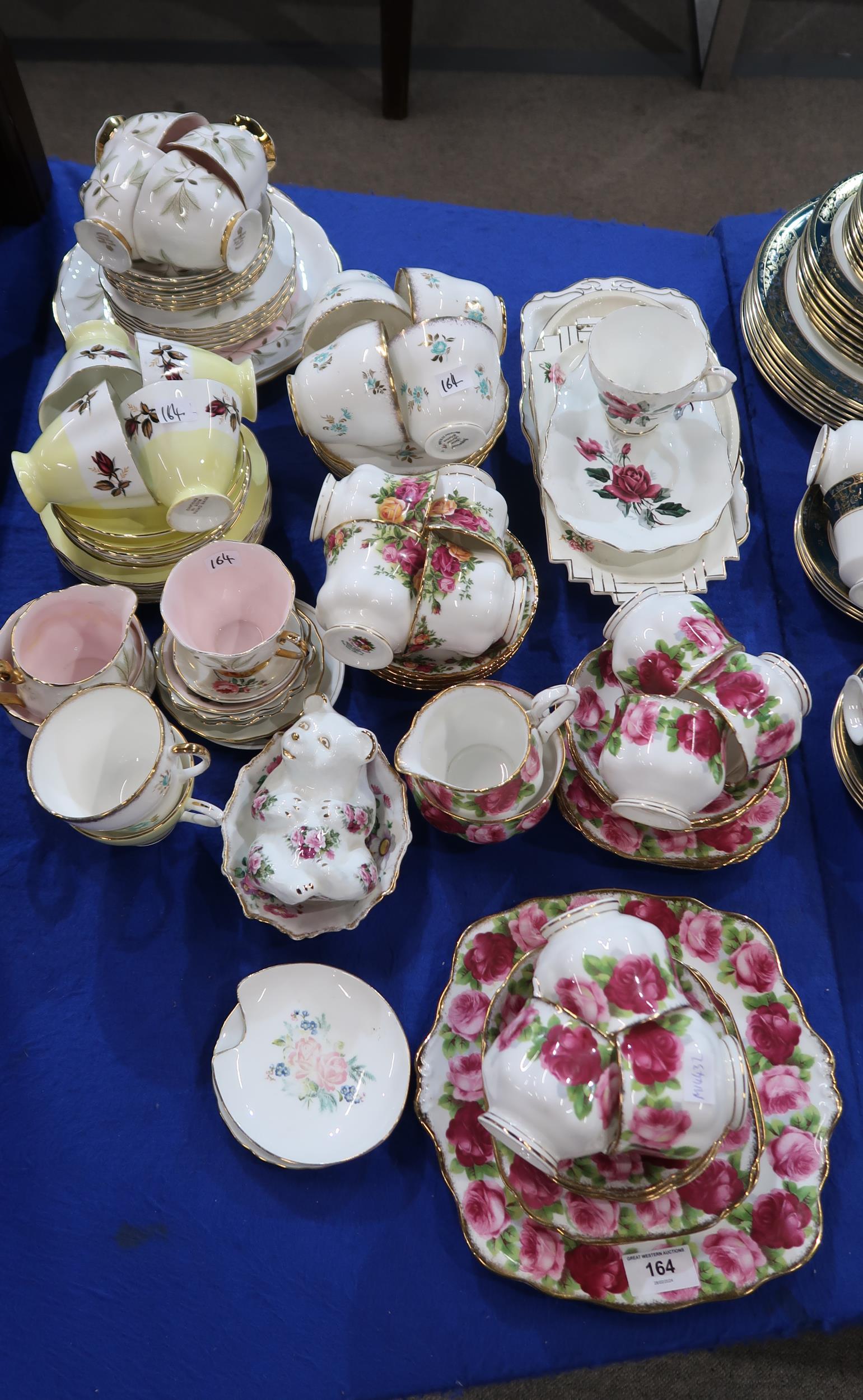 A Royal Albert Old English Rose pattern tea set comprising six trios, cake plate, milk jug and sugar