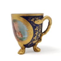 A continental porcelain cup, transfer printed with a scene of Siegfried and the Rhine daughters