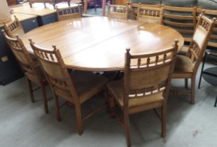 A large contemporary elm extending dining table on crossed pedestal base, 78cm high x 153cm long