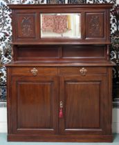 A late Victorian mahogany mirror backed sideboard with carved mirrored backsplash over two short