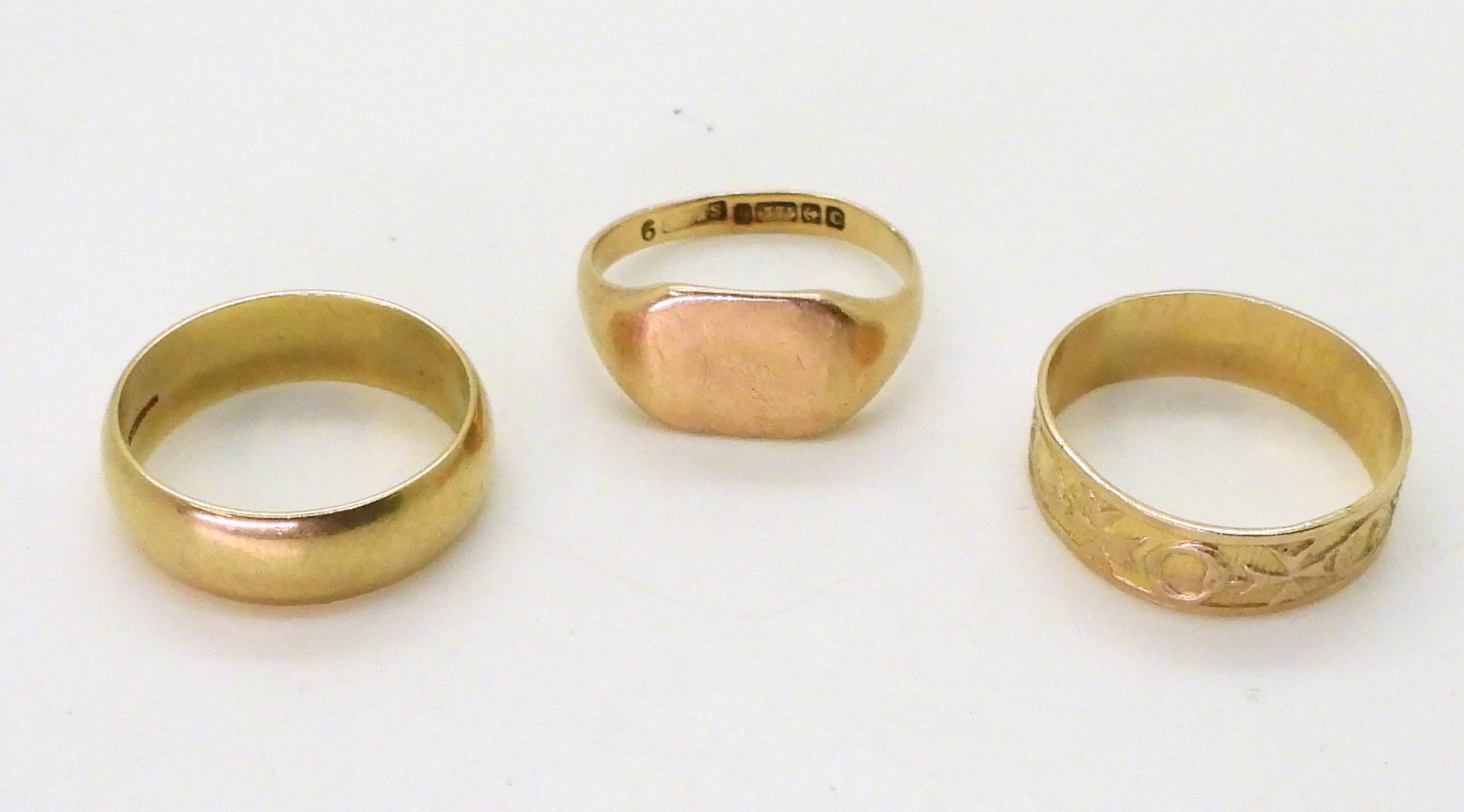 Two 9ct gold wedding rings, sizes Q1/2 and N and a signet ring, size O1/2, weight together 9.2gms - Image 2 of 2