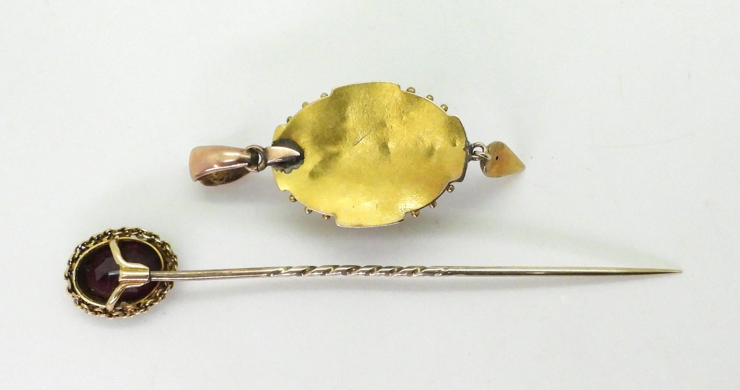 A Victorian yellow metal pendant set with a Bull's eye agate, with black and white Greek key and bud - Image 3 of 4