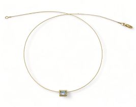 An 18ct gold sprung cable chain, with a blue topaz pendant, length 43cm weight together 2.5gms