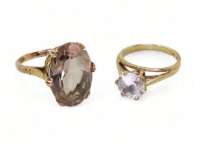 A 9ct gold smoky quartz ring, stamped Zeeta, finger size M, and a clear gem set solitaire, size L1/