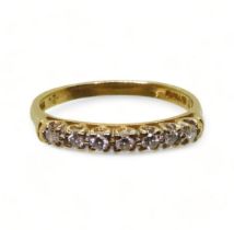 An 18ct gold diamond half eternity ring, set with estimated approx 0.20cts of brilliant cuts, size