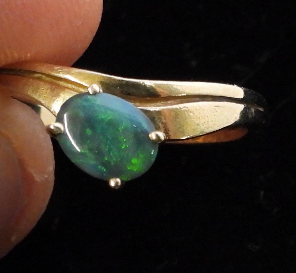 A 14k gold opal set ring, size P1/2, weight 2.6gms, together with a bright yellow metal ring, size - Image 2 of 2
