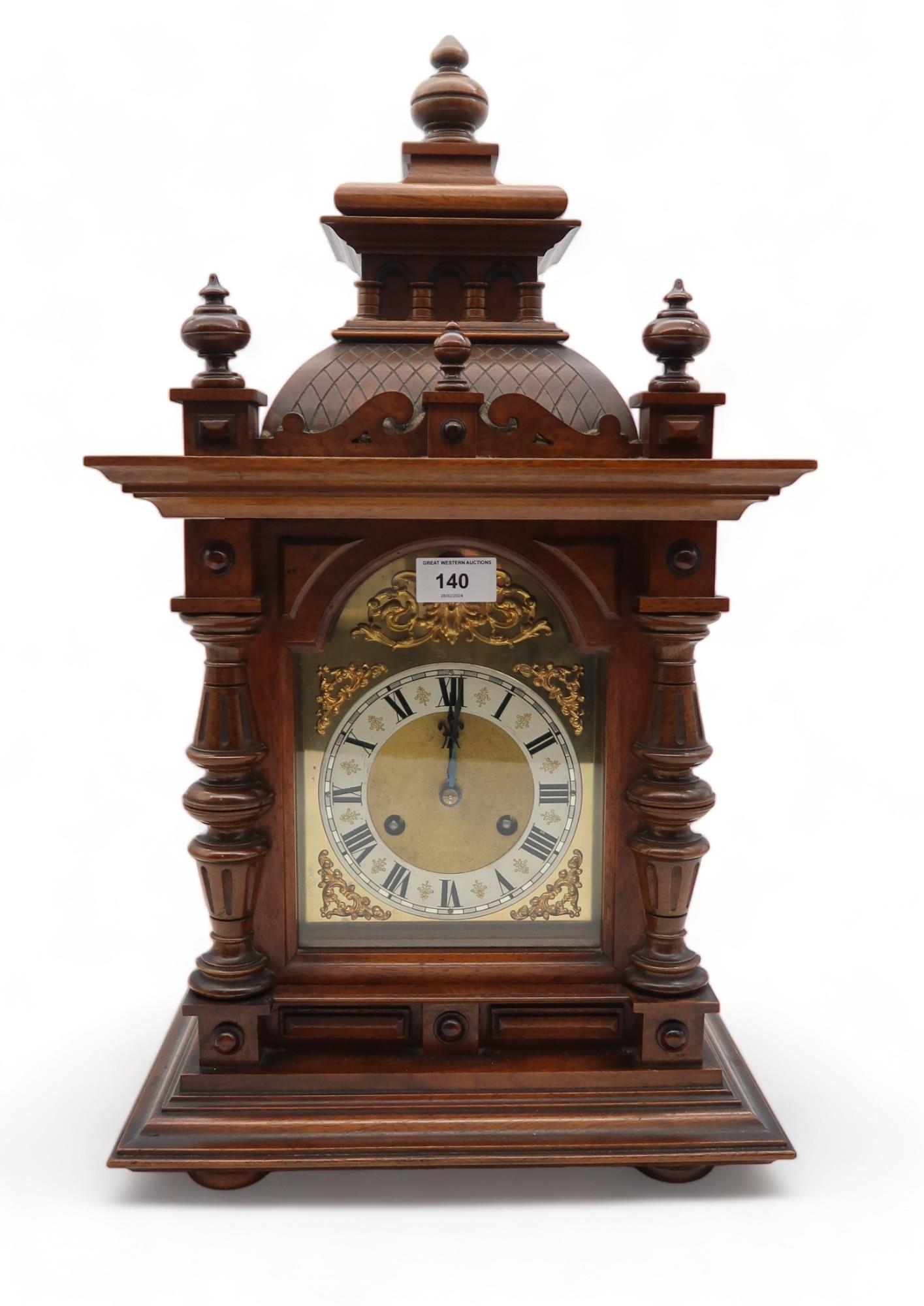 A wooden mantle  clock the silvered dial with ormolu mounts, with Jungans movement Condition