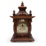 A wooden mantle  clock the silvered dial with ormolu mounts, with Jungans movement Condition