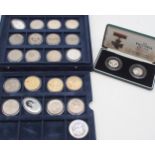 A lot comprising a commemorative Morgan Dollar, Elizabeth II crowns and The Victoria Cross 1856-2006