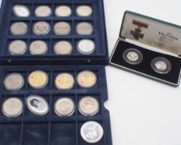 A lot comprising a commemorative Morgan Dollar, Elizabeth II crowns and The Victoria Cross 1856-2006