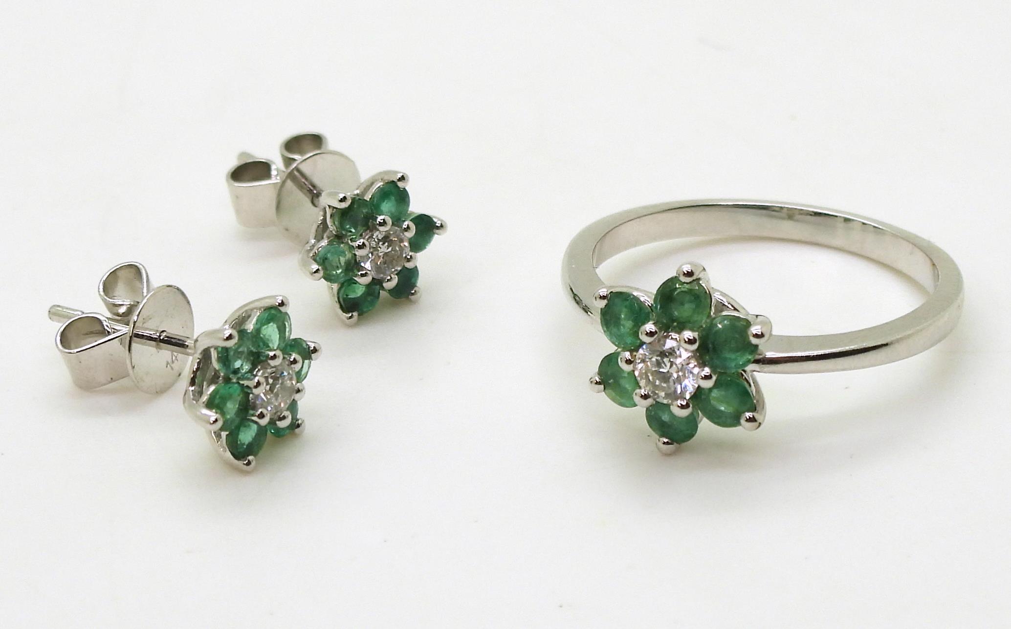 A 14k white gold emerald and diamond flower ring, size O, with matching earrings, set with estimated - Image 2 of 3