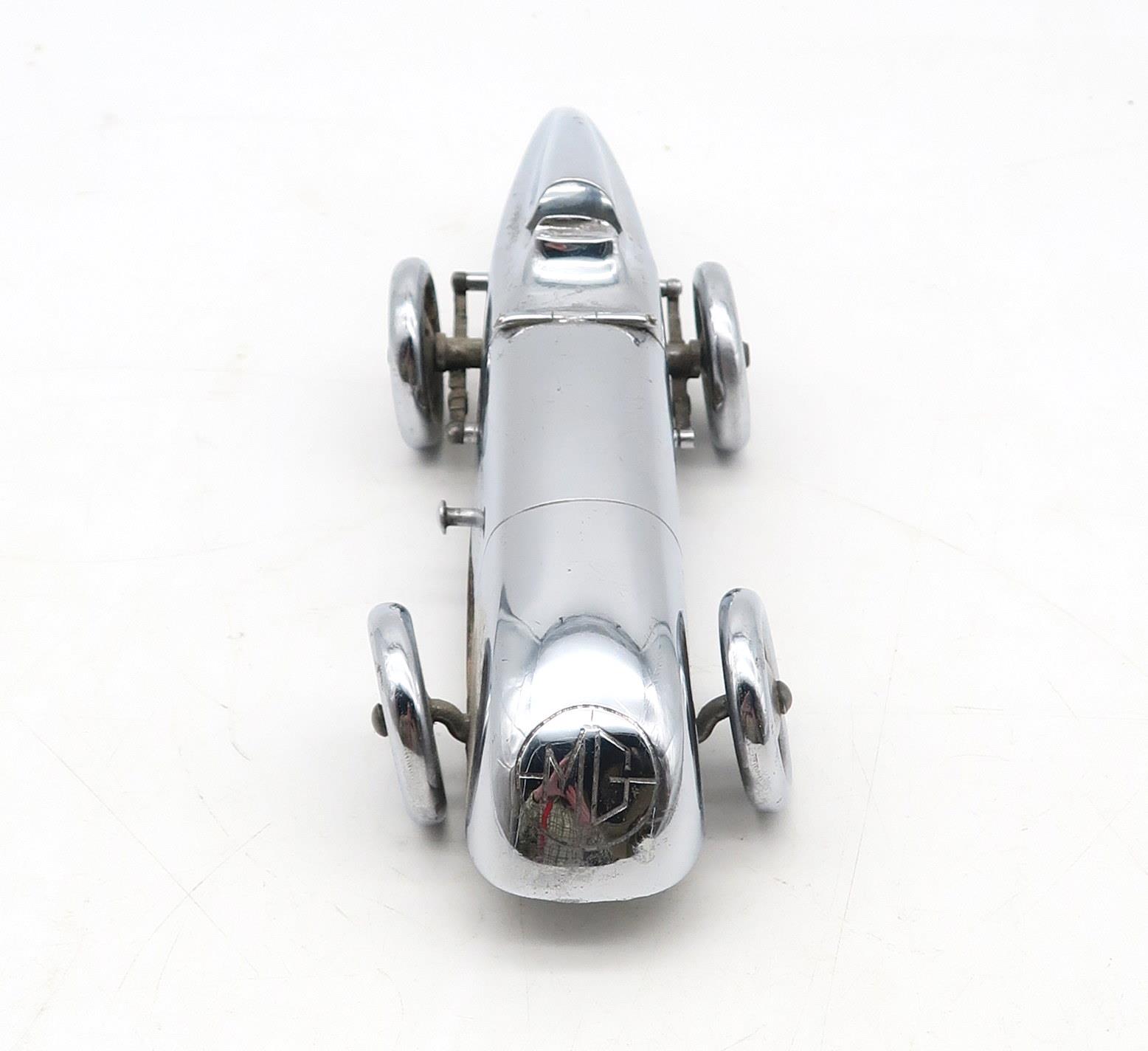 A chrome-plated Art Deco MG "Magic Midget" table lighter, marked to the underside "S&M, Made in - Image 3 of 5
