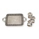 A set of Ciaro work niello white metal napkin rings, and an Indian Parsee white metal tray,