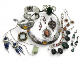 A collection of gem set silver jewellery to include an amber torc style necklace and similar