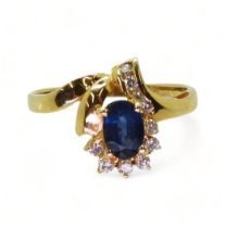 An 18k gold sapphire and diamond ring, size M1/2, weight 2.4gms Condition Report:Available upon